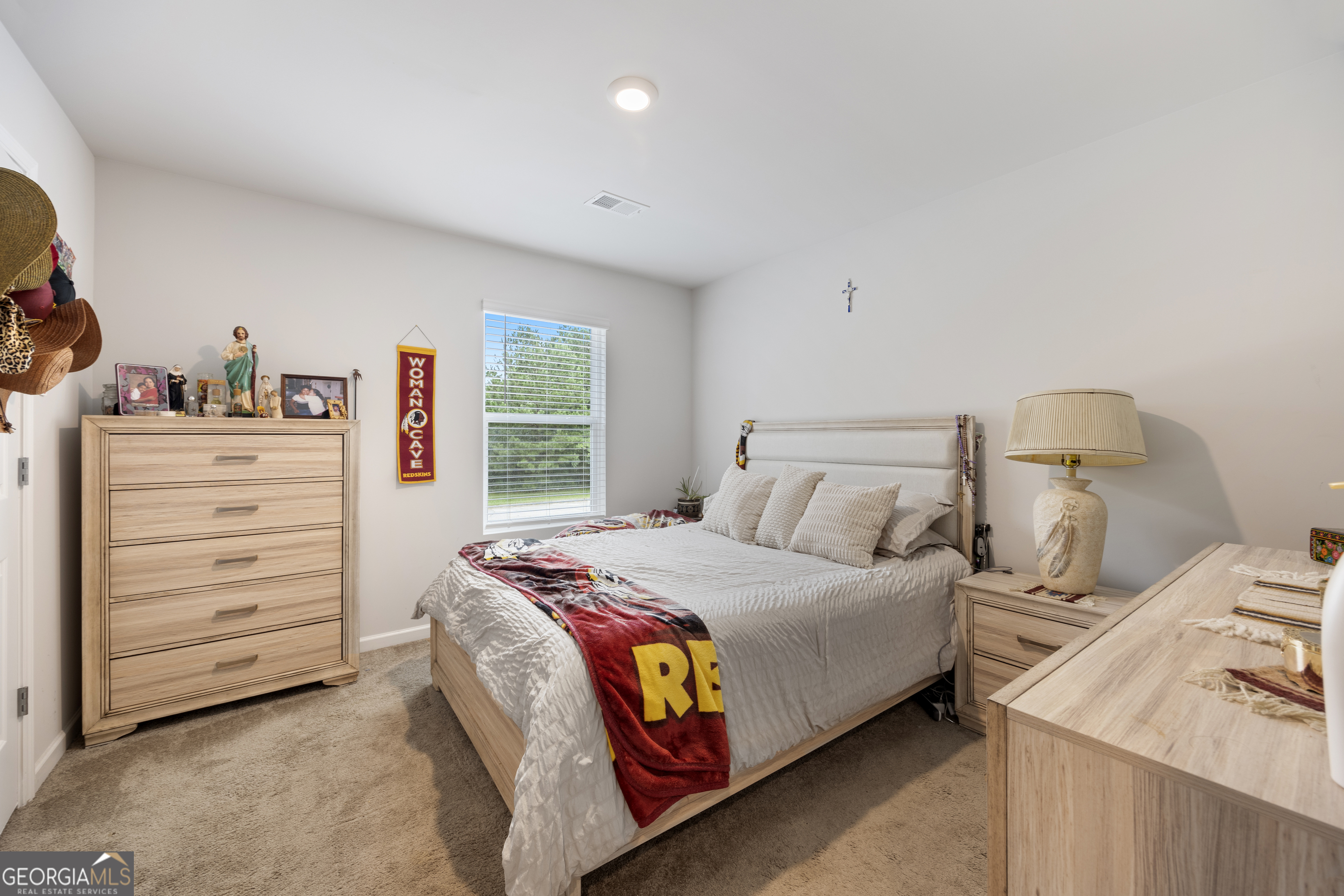 94 Galway Lane Hampton, GA 30228 - Photo 18 of 25 a bedroom with a bed and a dresser