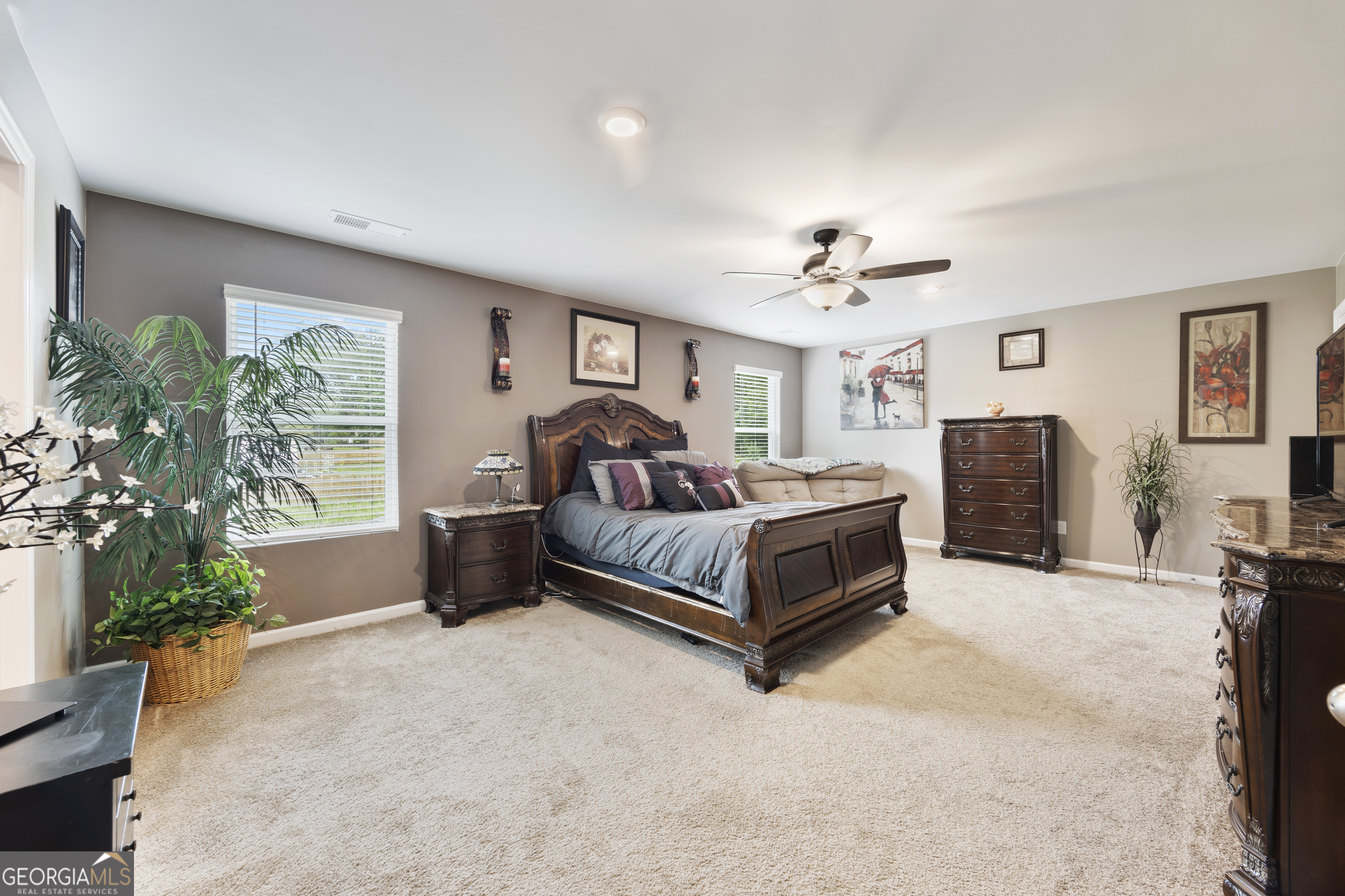 94 Galway Lane Hampton, GA 30228 - Photo 19 of 25 a bedroom with a bed couch and a window