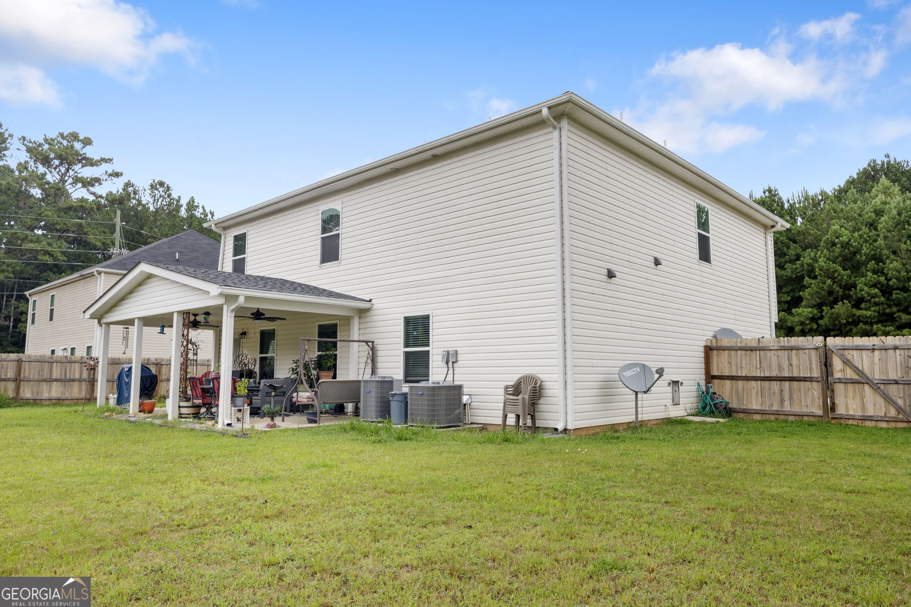 94 Galway Lane Hampton, GA 30228 - Photo 10 of 25 a view of a house with backyard and porch