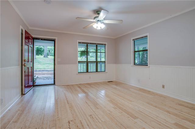 1181 Simms Heights Road Kingston Springs, TN 37082 - Photo 4 of 20 Front entrance into spacious den with wood floor.
