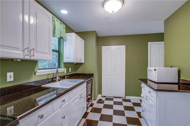 1181 Simms Heights Road Kingston Springs, TN 37082 - Photo 7 of 20 Newly renovated kitchen has granite countertops. The stainless refrigerator remains.