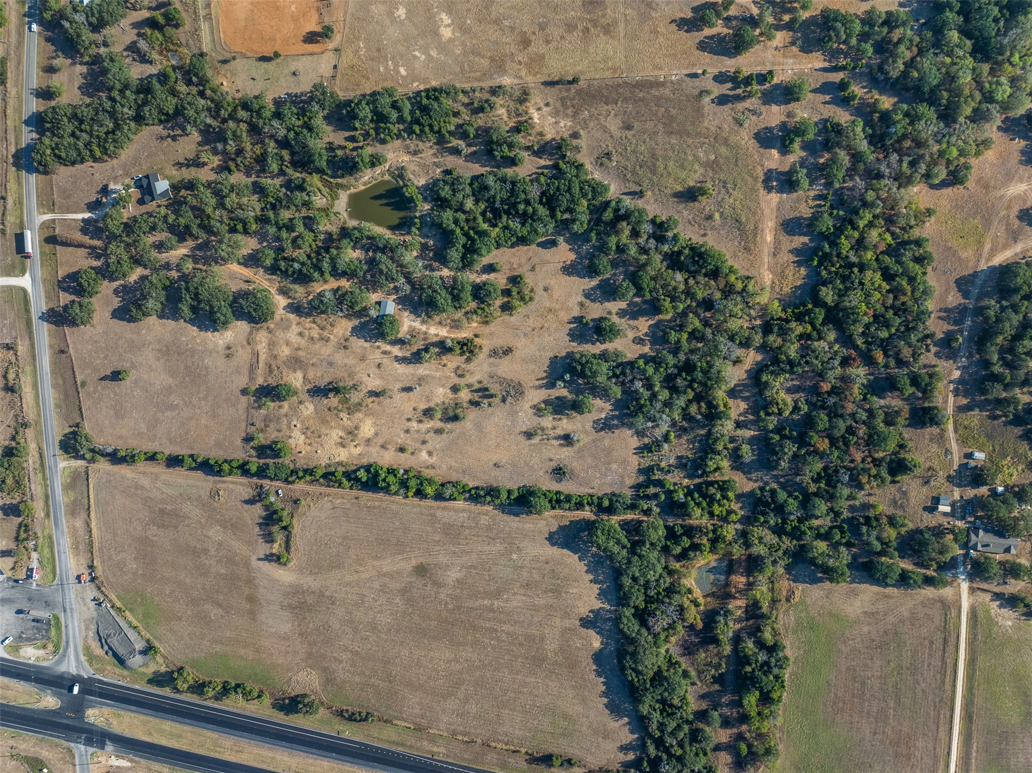 696 Tract 1 Elgin, TX 78621 - Photo 13 of 27 an aerial view of residential houses with outdoor space