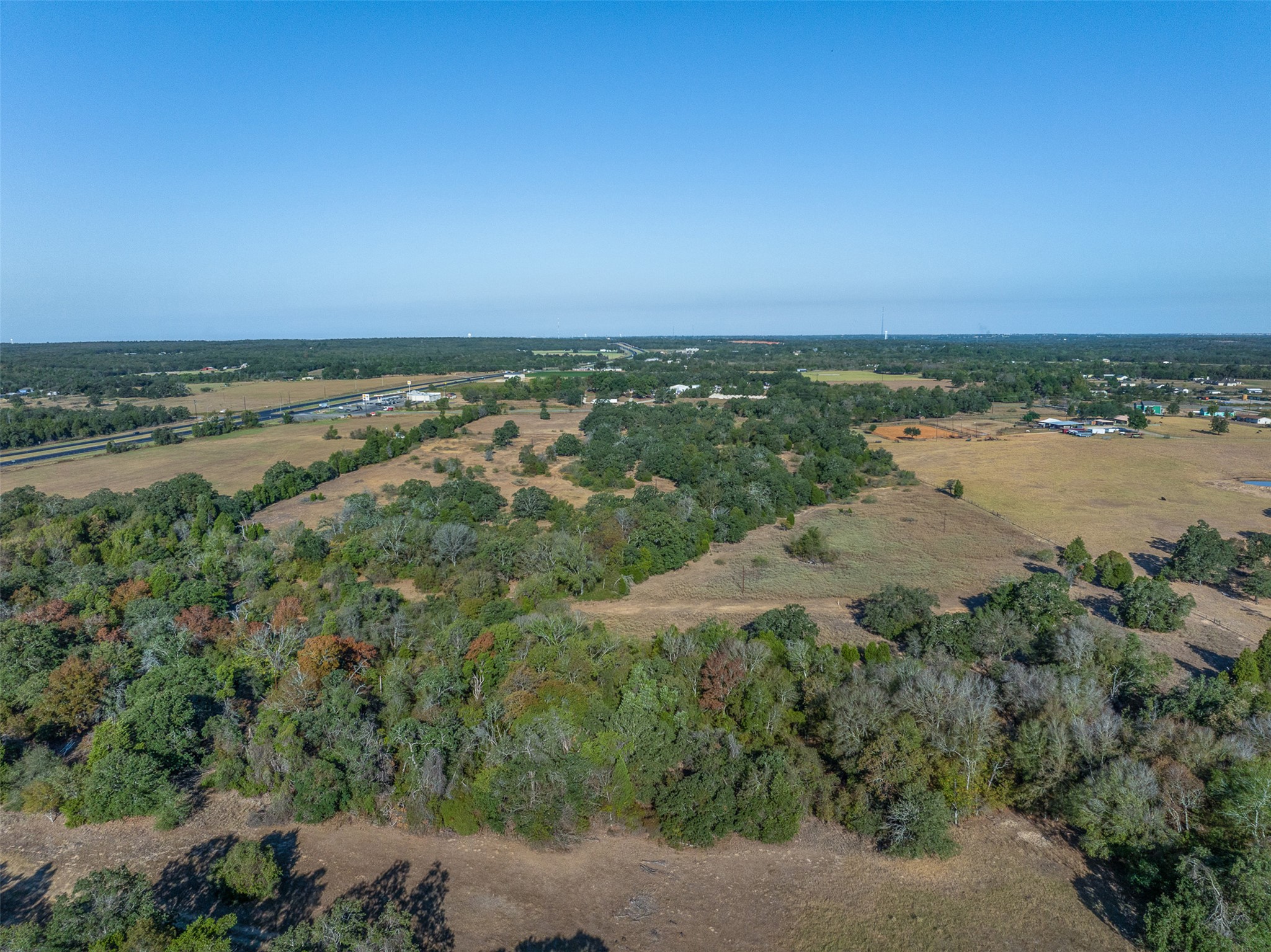 696 Tract 1 Elgin, TX 78621 - Photo 17 of 27 an aerial view of beach and residential houses with outdoor space