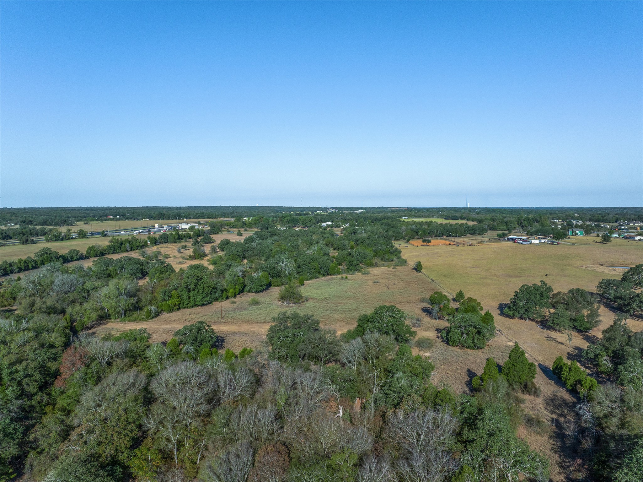 696 Tract 1 Elgin, TX 78621 - Photo 22 of 27 a view of a lake with houses in the back