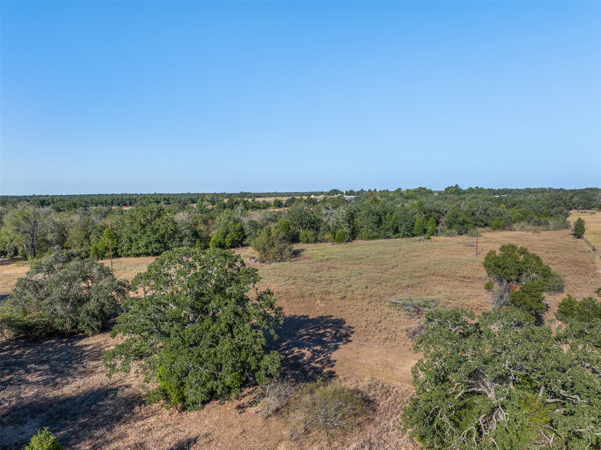 696 Tract 1 Elgin, TX 78621 - Photo 24 of 27 a view of a lake with houses in back