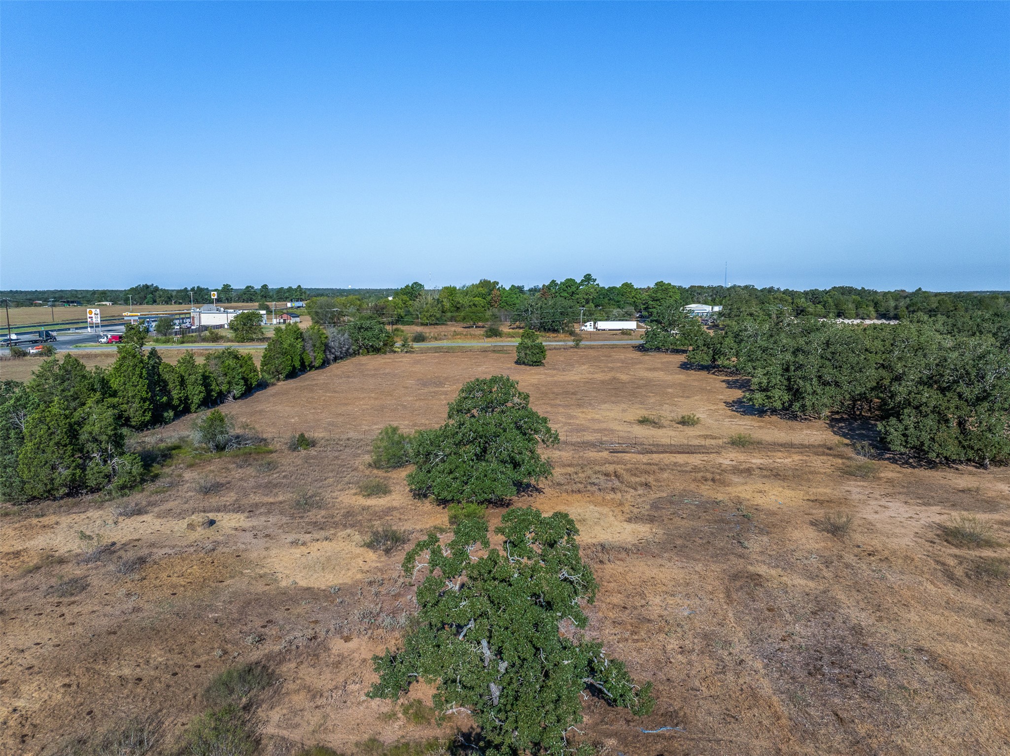 696 Tract 1 Elgin, TX 78621 - Photo 26 of 27 an aerial view of a beach with a yard and lake view