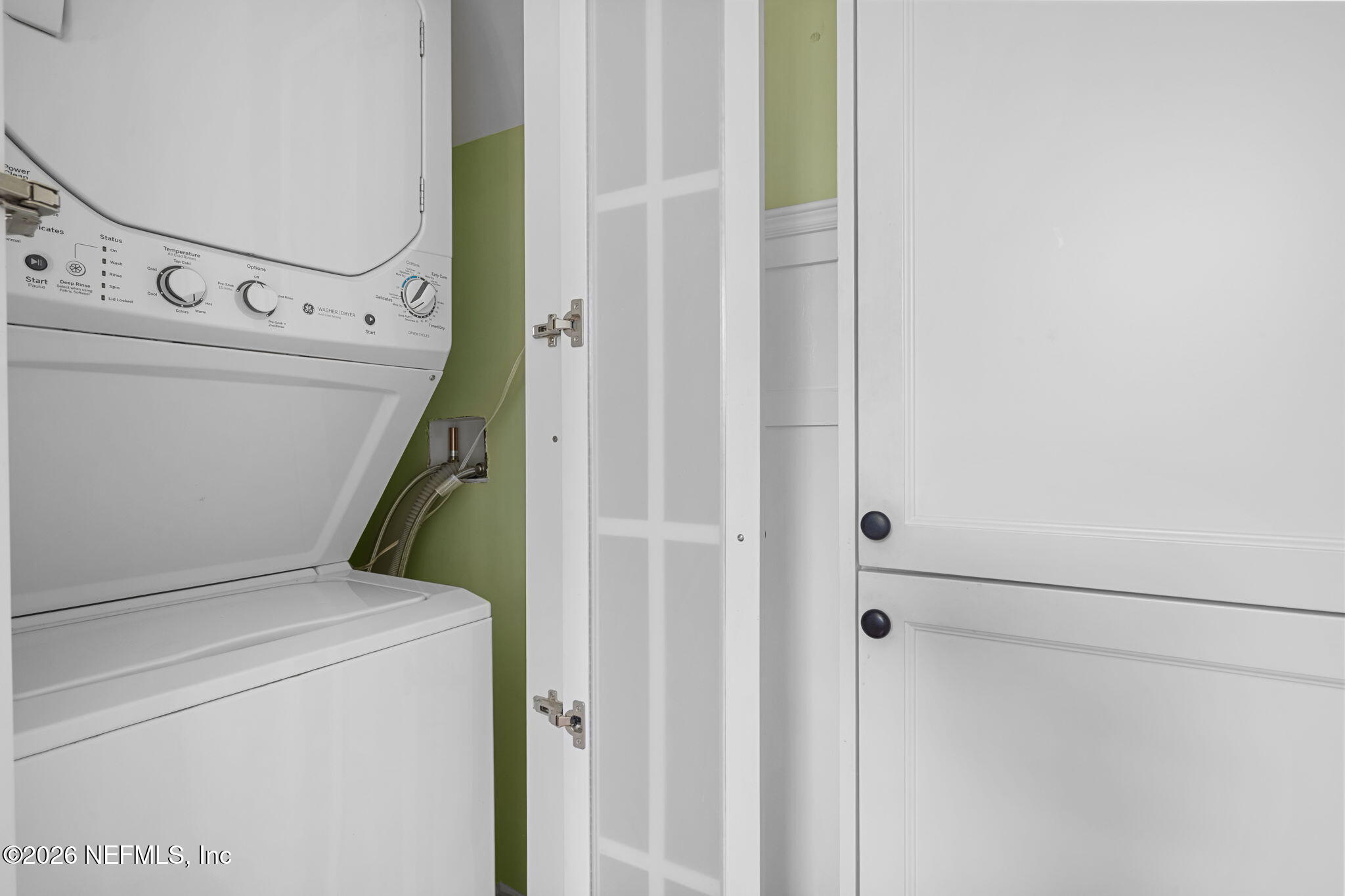 1127 Riviera Street Jacksonville, FL 32207 - Photo 16 of 40 a utility room with dryer and washer