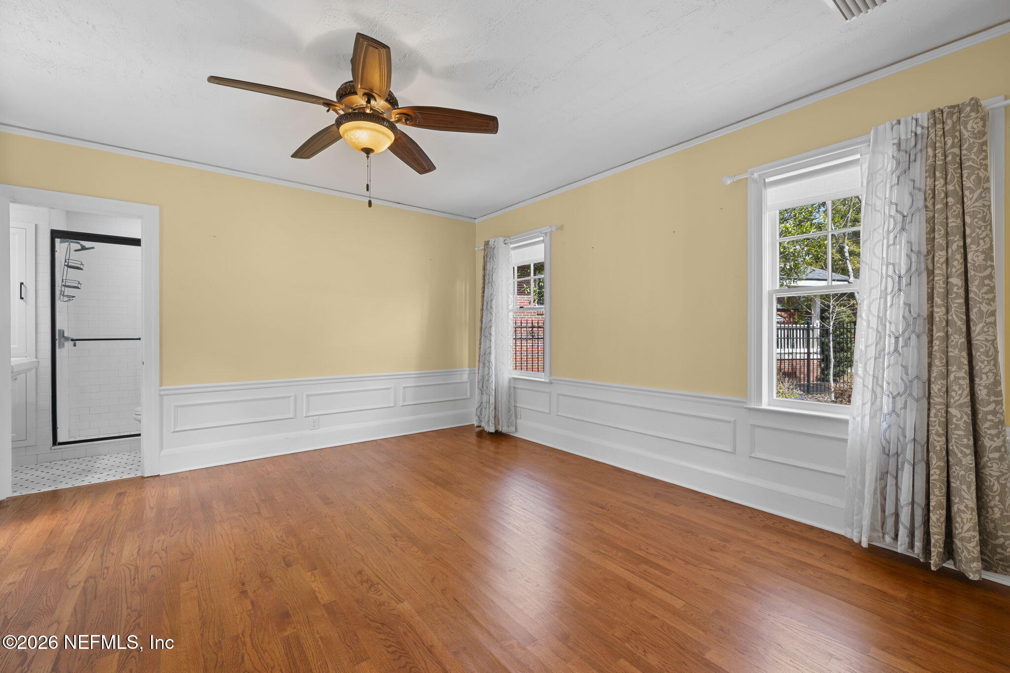 1127 Riviera Street Jacksonville, FL 32207 - Photo 20 of 40 a view of empty room with wooden floor and fan