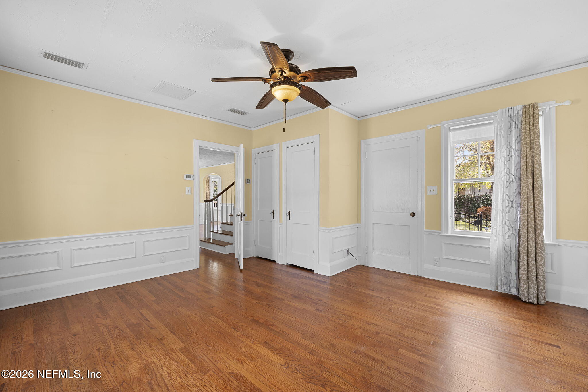 1127 Riviera Street Jacksonville, FL 32207 - Photo 21 of 40 a view of empty room with wooden floor and fan