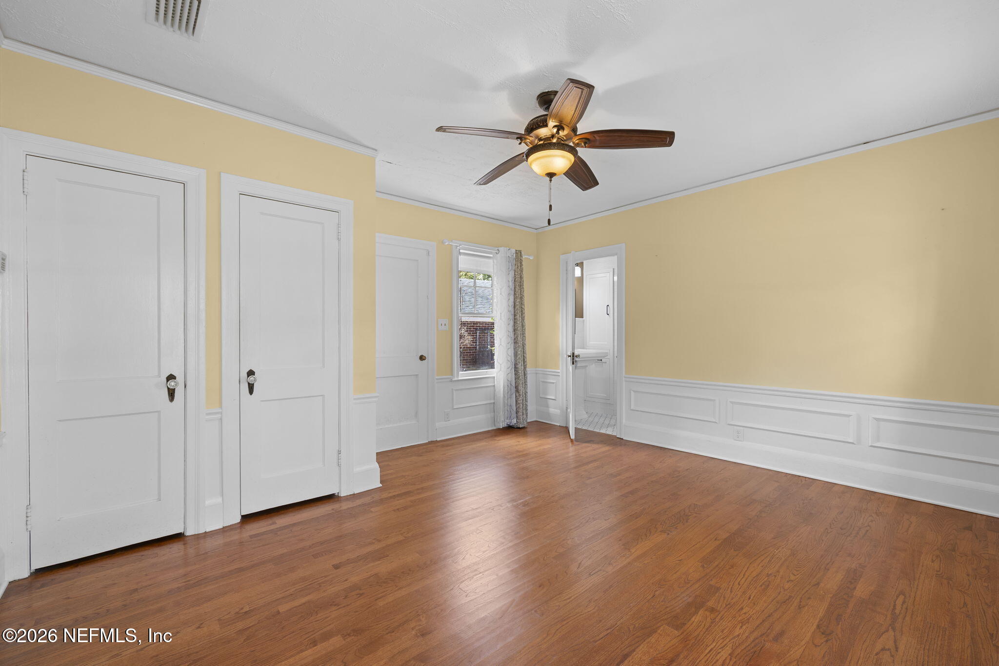 1127 Riviera Street Jacksonville, FL 32207 - Photo 22 of 40 a view of room with wooden floor and ceiling fan