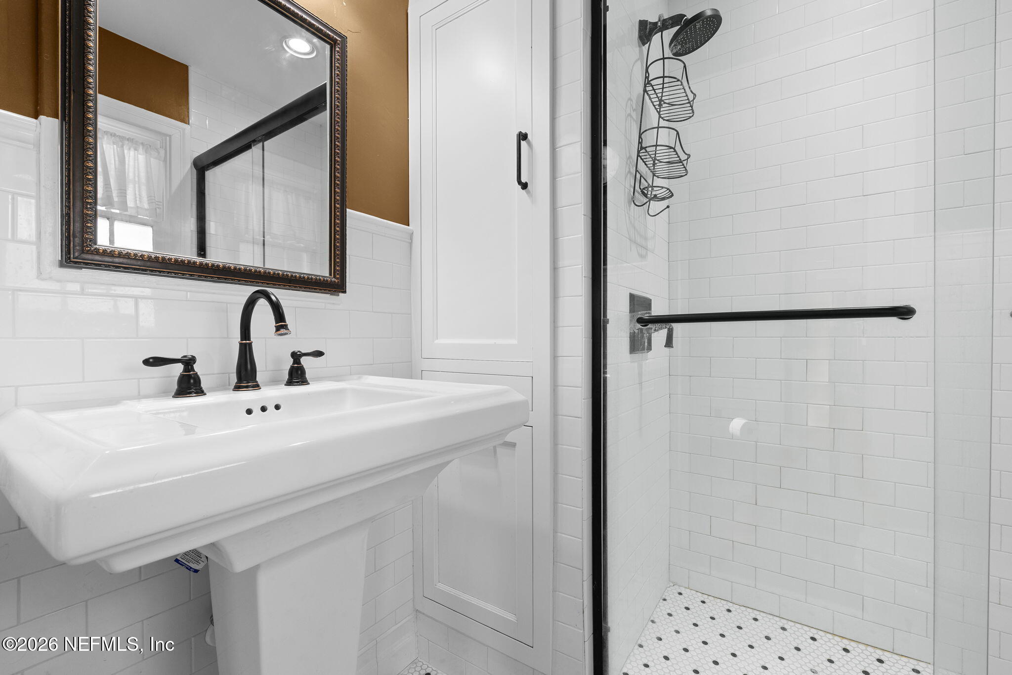 1127 Riviera Street Jacksonville, FL 32207 - Photo 23 of 40 a bathroom with a sink and mirror