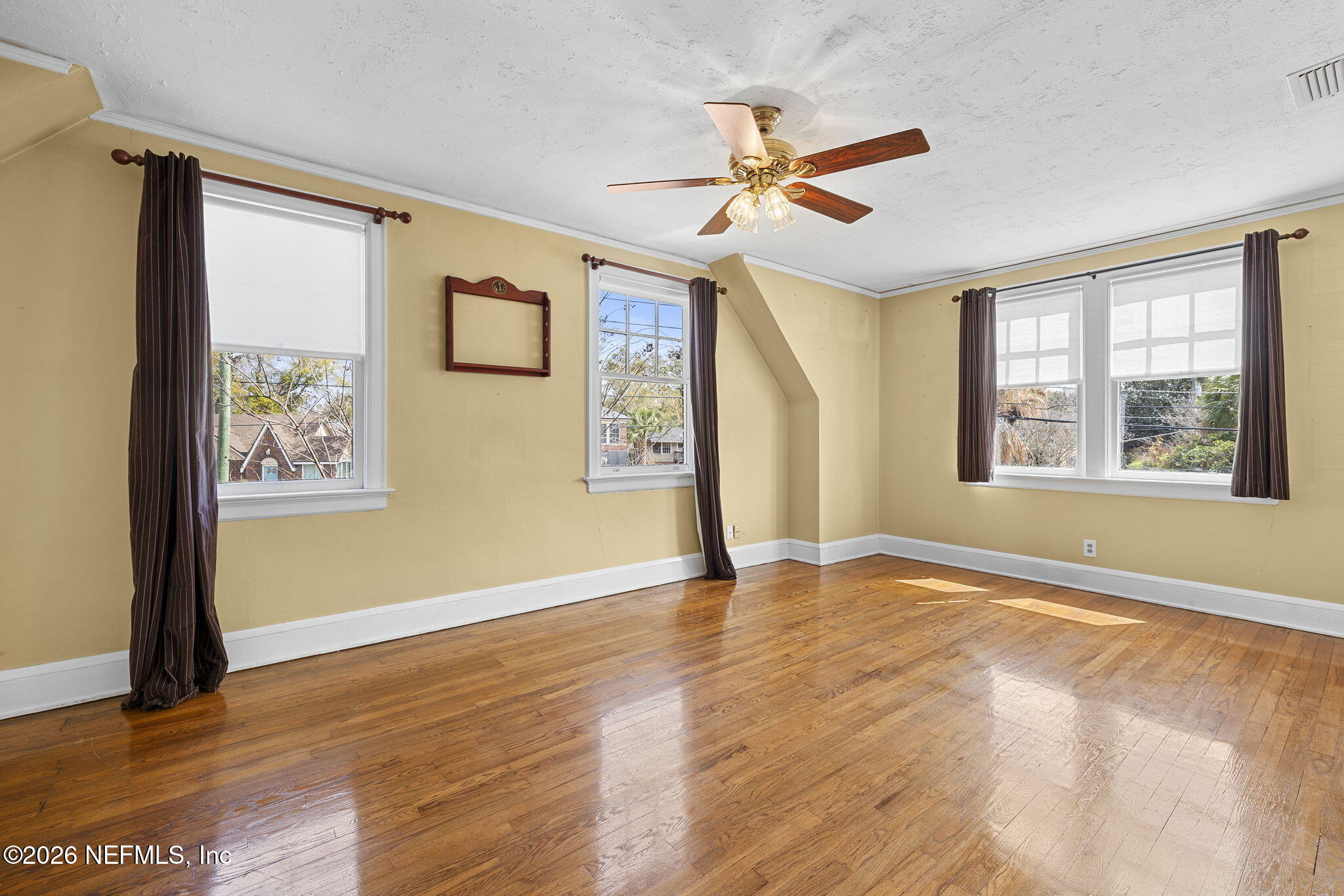 1127 Riviera Street Jacksonville, FL 32207 - Photo 24 of 40 a view of an empty room with window and wooden floor