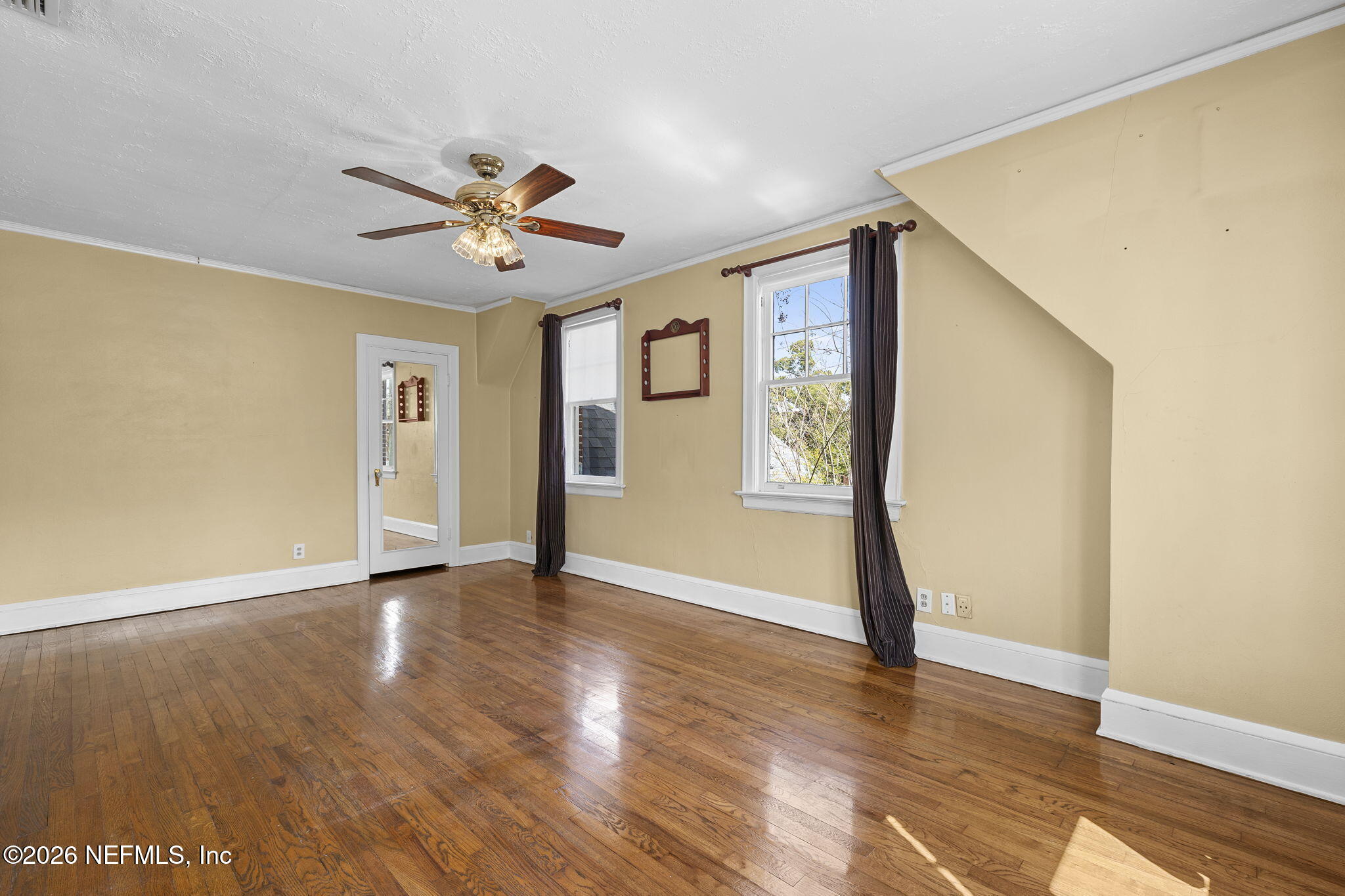 1127 Riviera Street Jacksonville, FL 32207 - Photo 28 of 40 a view of an empty room with window and wooden floor
