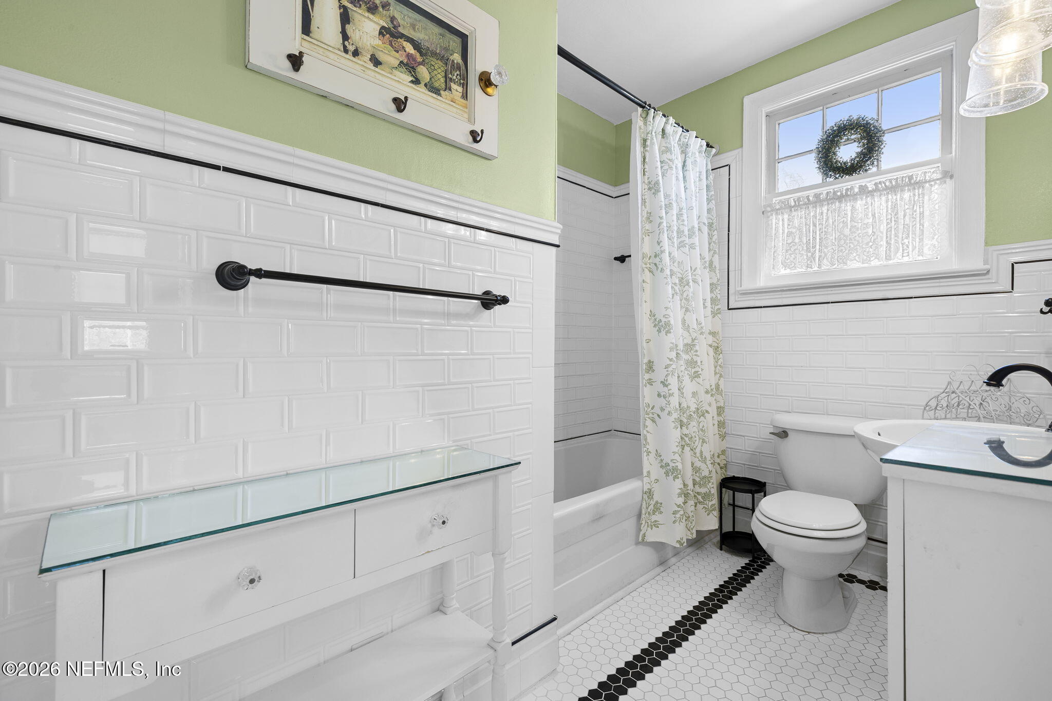 1127 Riviera Street Jacksonville, FL 32207 - Photo 29 of 40 a bathroom with a sink a toilet and shower