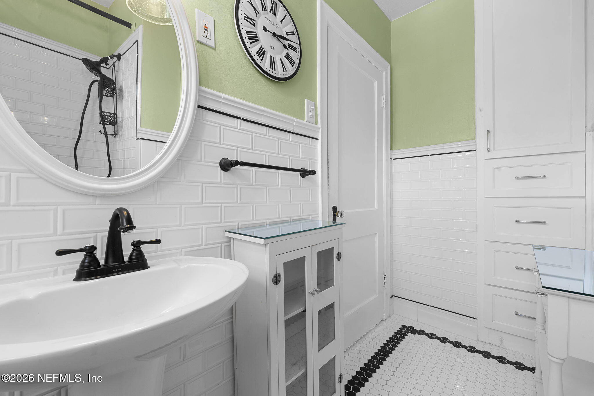 1127 Riviera Street Jacksonville, FL 32207 - Photo 30 of 40 a bathroom with a sink and a mirror