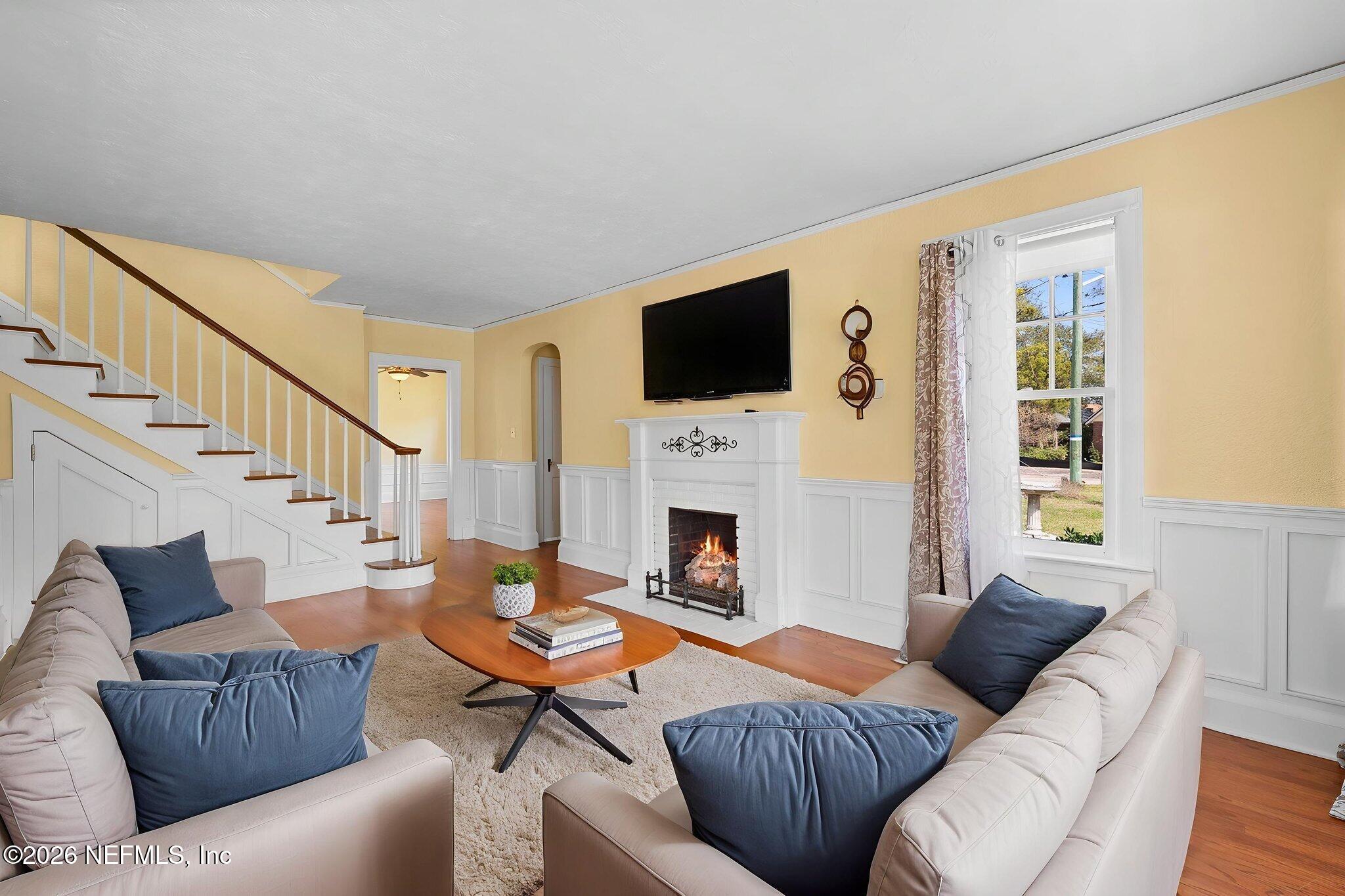 1127 Riviera Street Jacksonville, FL 32207 - Photo 5 of 40 a living room with fireplace furniture and a flat screen tv