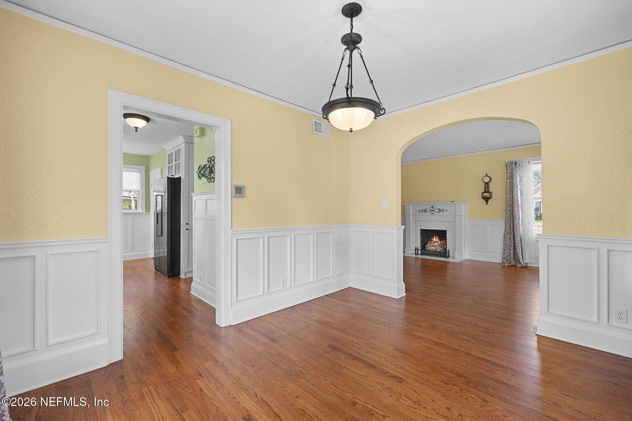 1127 Riviera Street Jacksonville, FL 32207 - Photo 8 of 40 a view of a livingroom with wooden floor and chandelier