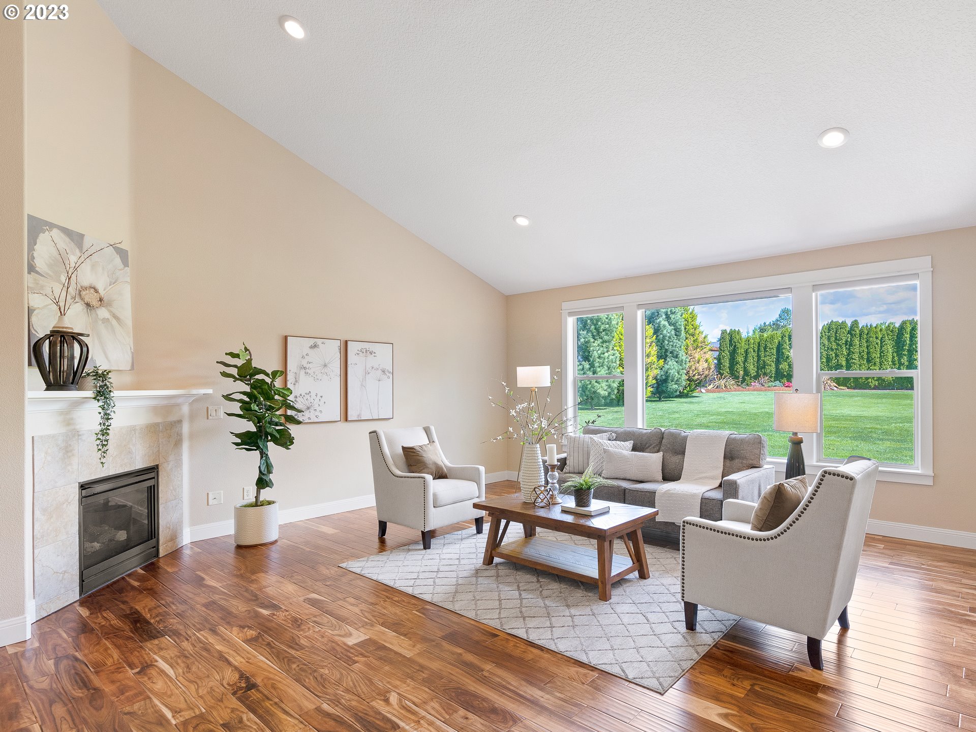 13920 Southeast Richey Road Boring, OR 97009 - Photo 6 of 42 a living room with furniture a fireplace and a floor to ceiling window