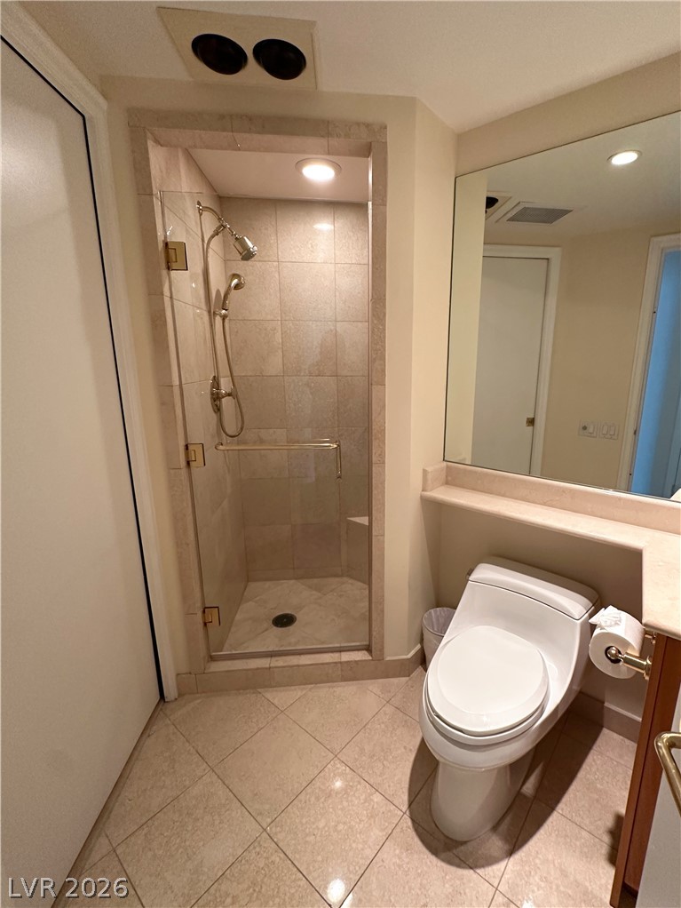 2747 Paradise Road, Unit 1706 Las Vegas, NV 89109 - Photo 22 of 35 A sleek, fully tiled walk-in shower and contemporary toilet create a refreshing bathroom space.