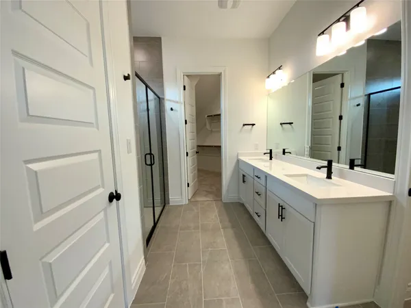 a bathroom with a tub and a sink