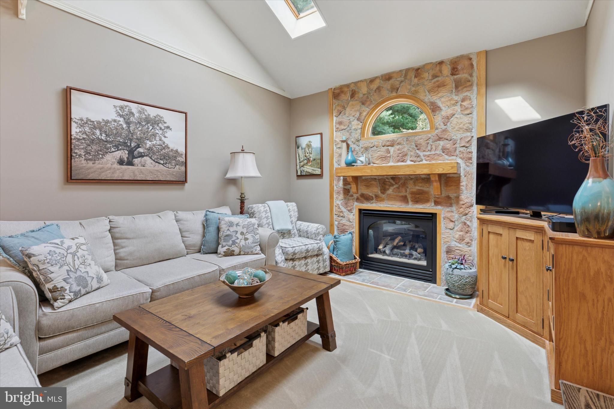 1402 Valley View Warrington, PA 18976 - Photo 12 of 51 a living room with furniture a flat screen tv and a fireplace