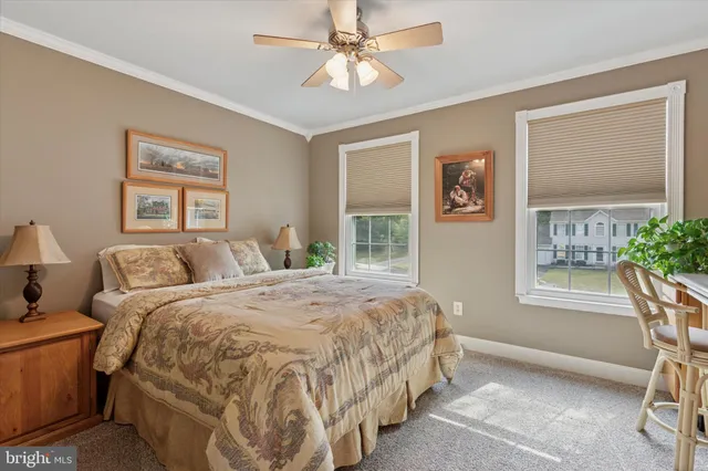 a spacious bedroom with a bed and a window