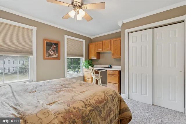 a bedroom with a large bed and a window