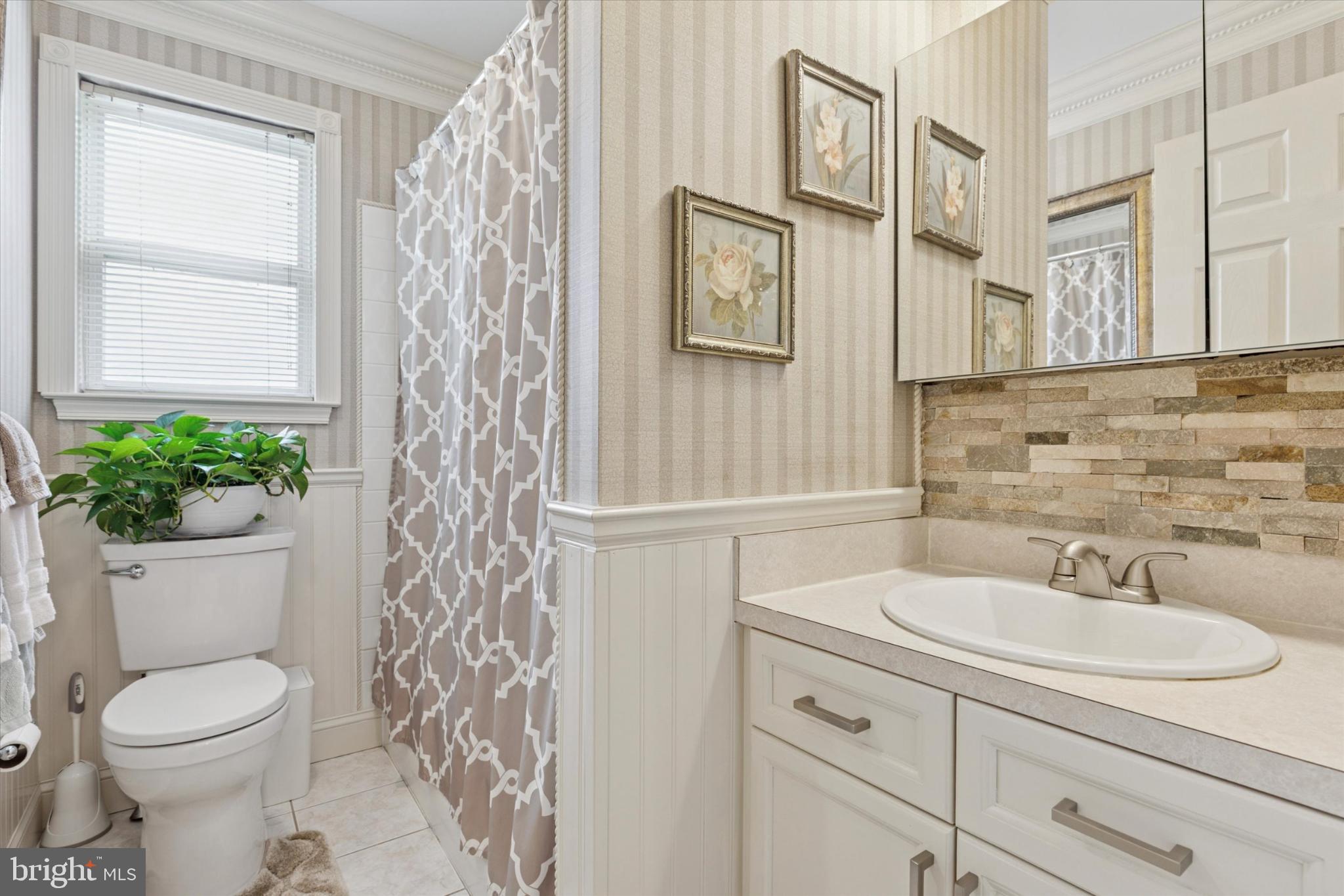 1402 Valley View Warrington, PA 18976 - Photo 28 of 51 a bathroom with a sink a toilet and a mirror