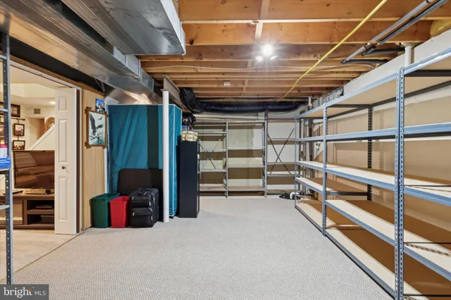 a view of an empty room with storage