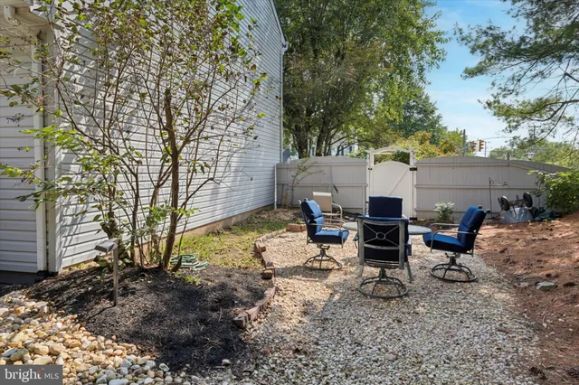 a view of backyard with outdoor seating
