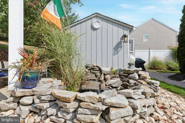 a view of a chairs and table in the backyard