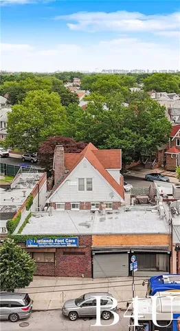 a view of multiple house with a ocean view