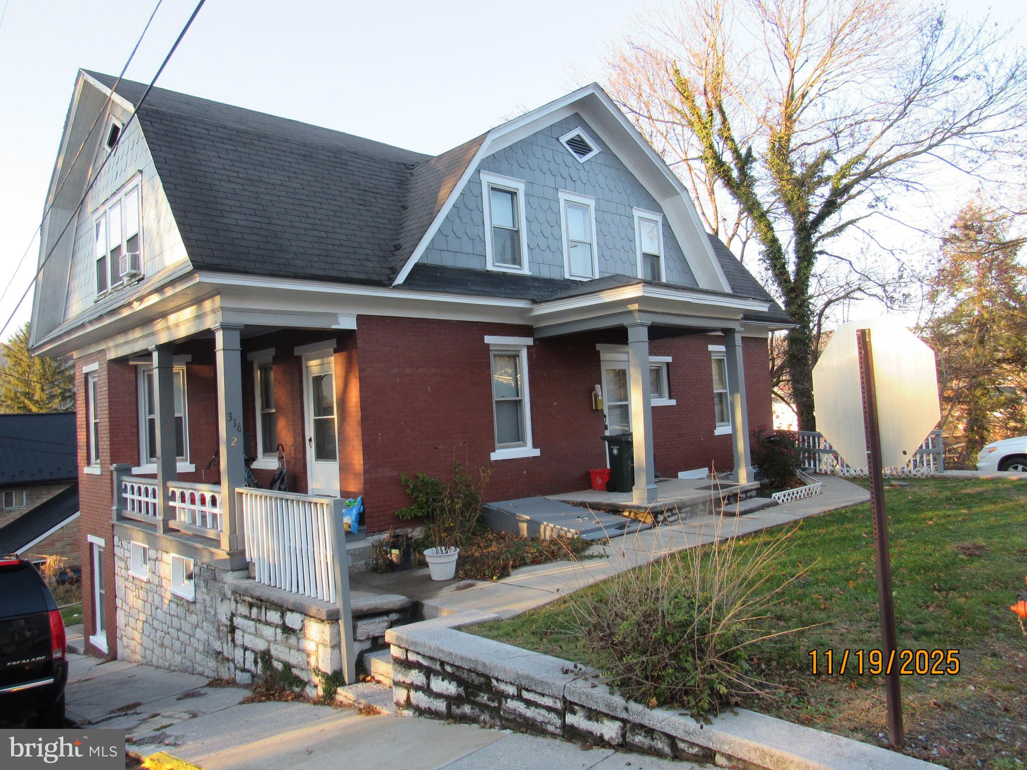 316 South Spring Street Bellefonte, PA 16823 - Photo 2 of 4 a front view of a house with garden