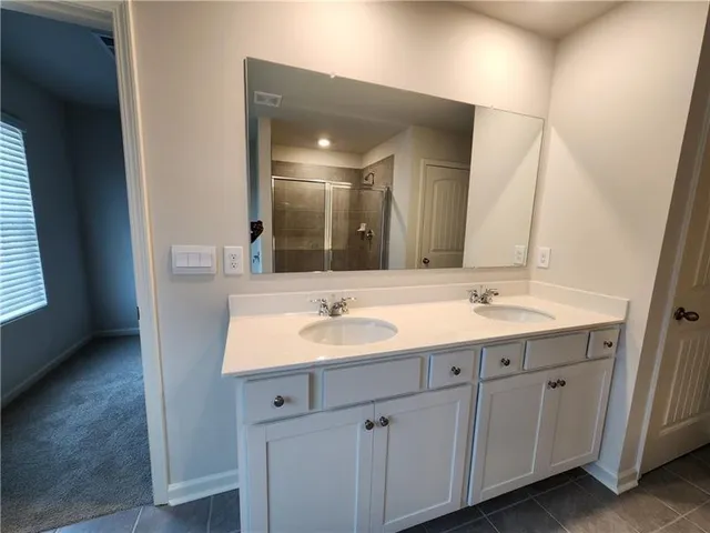 a bathroom with a bathtub and a sink