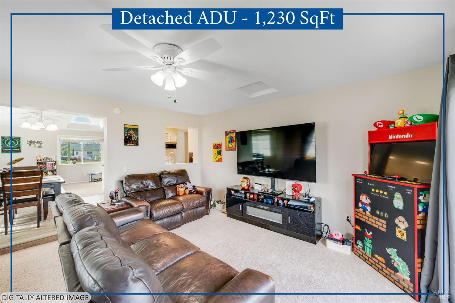 7500 North Meridian Road Vacaville, CA 95688 - Photo 12 of 38 a living room with furniture and a flat screen tv