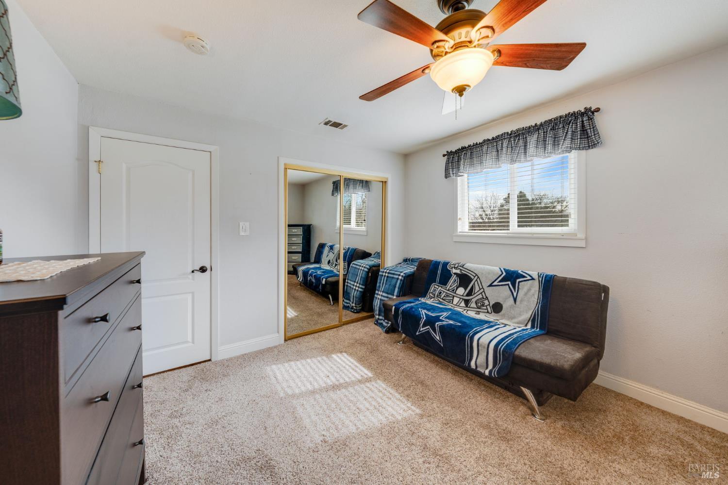 7500 North Meridian Road Vacaville, CA 95688 - Photo 22 of 38 a living room with furniture and a chandelier