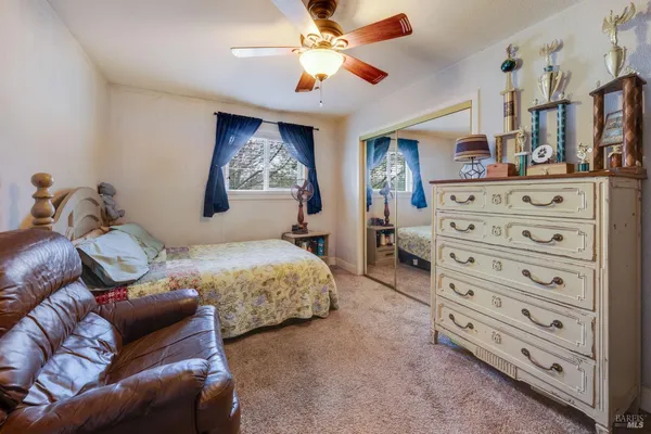 a bedroom with a bed and a television