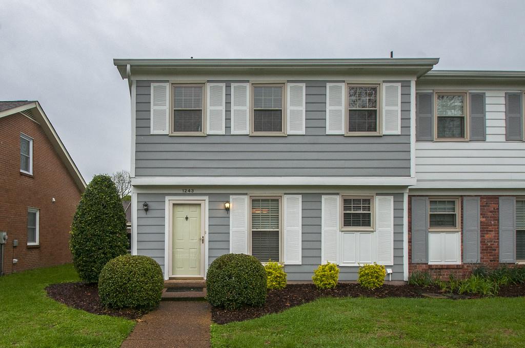 1243 General George Patton Road Nashville, TN 37221 - Photo 1 of 25 a front view of a house with a yard