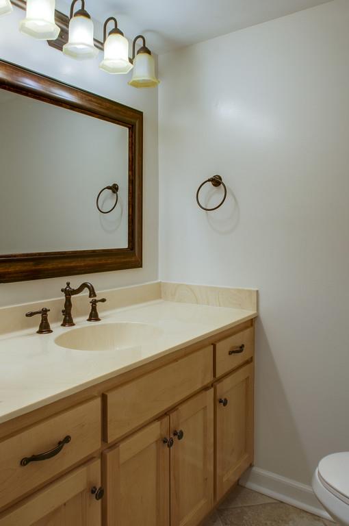 1243 General George Patton Road Nashville, TN 37221 - Photo 11 of 25 a bathroom with a sink and a mirror