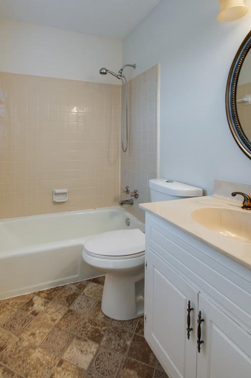 1243 General George Patton Road Nashville, TN 37221 - Photo 14 of 25 a bathroom with a sink a toilet and a bathtub