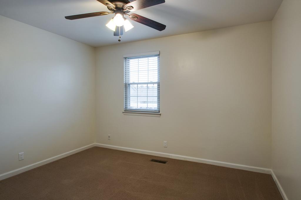 1243 General George Patton Road Nashville, TN 37221 - Photo 16 of 25 an empty room with a window and a fan