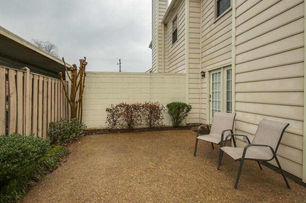 1243 General George Patton Road Nashville, TN 37221 - Photo 21 of 25 a view of a patio with table and chairs and iron fence