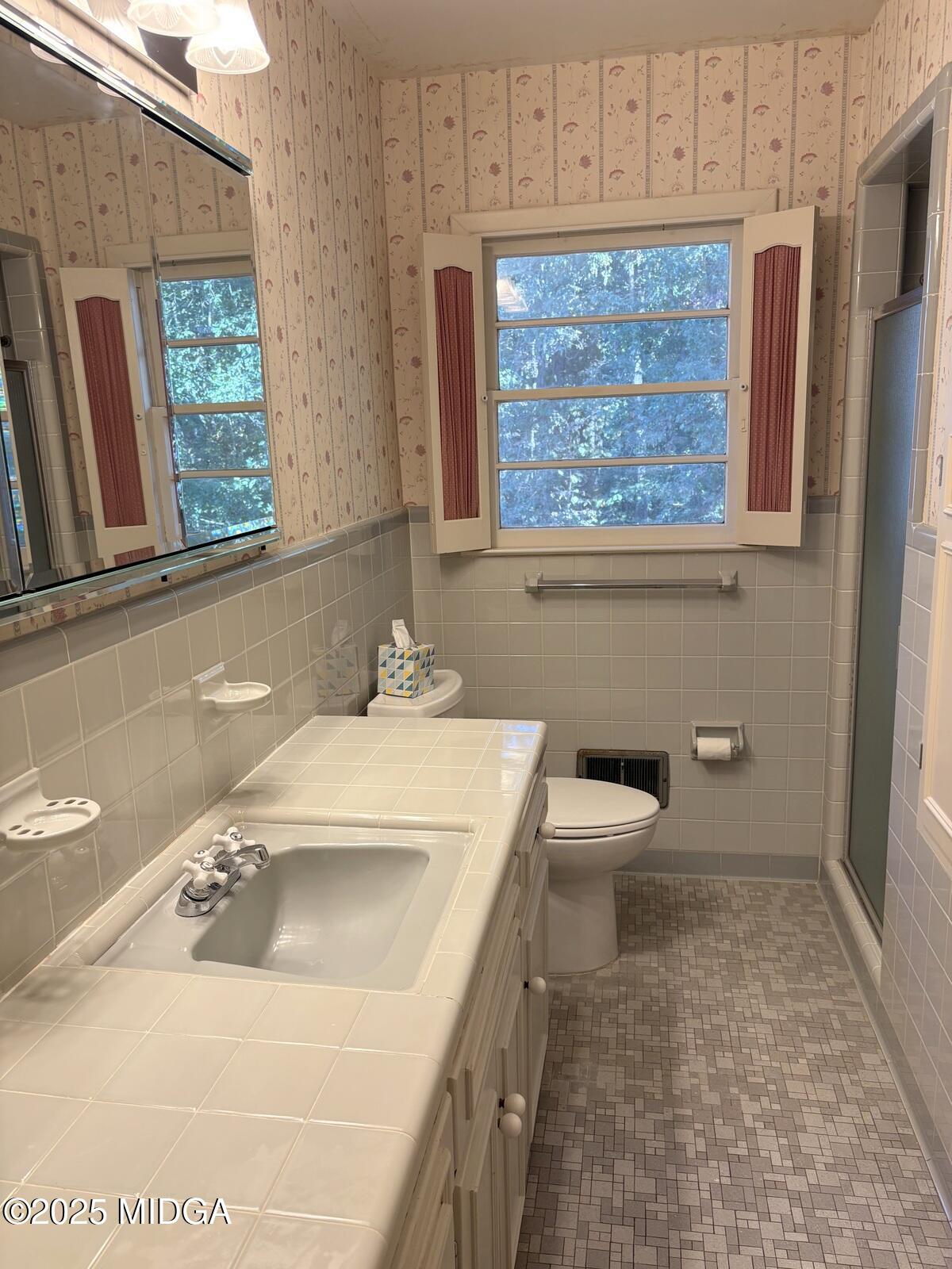 161 Ten Knolls Drive Macon, GA 31210 - Photo 11 of 21 a bathroom with a sink a toilet and a window