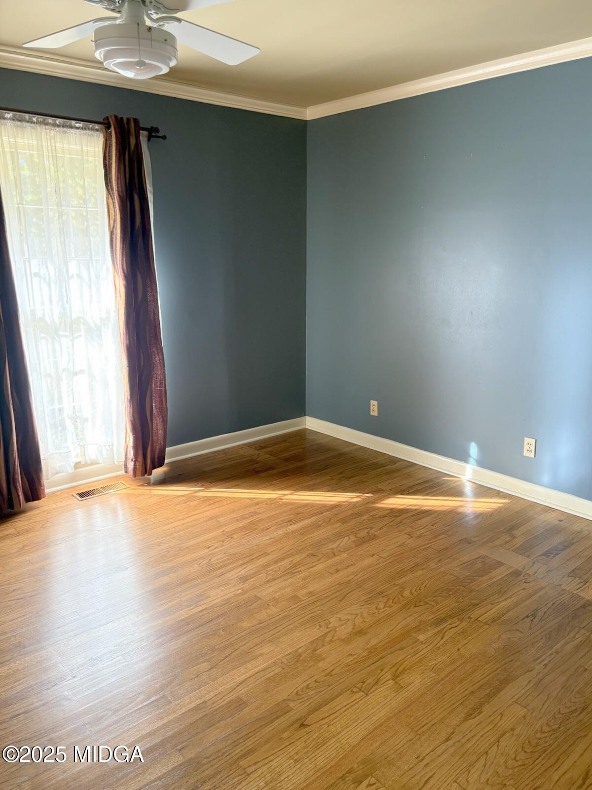 161 Ten Knolls Drive Macon, GA 31210 - Photo 12 of 21 an empty room with wooden floor and windows