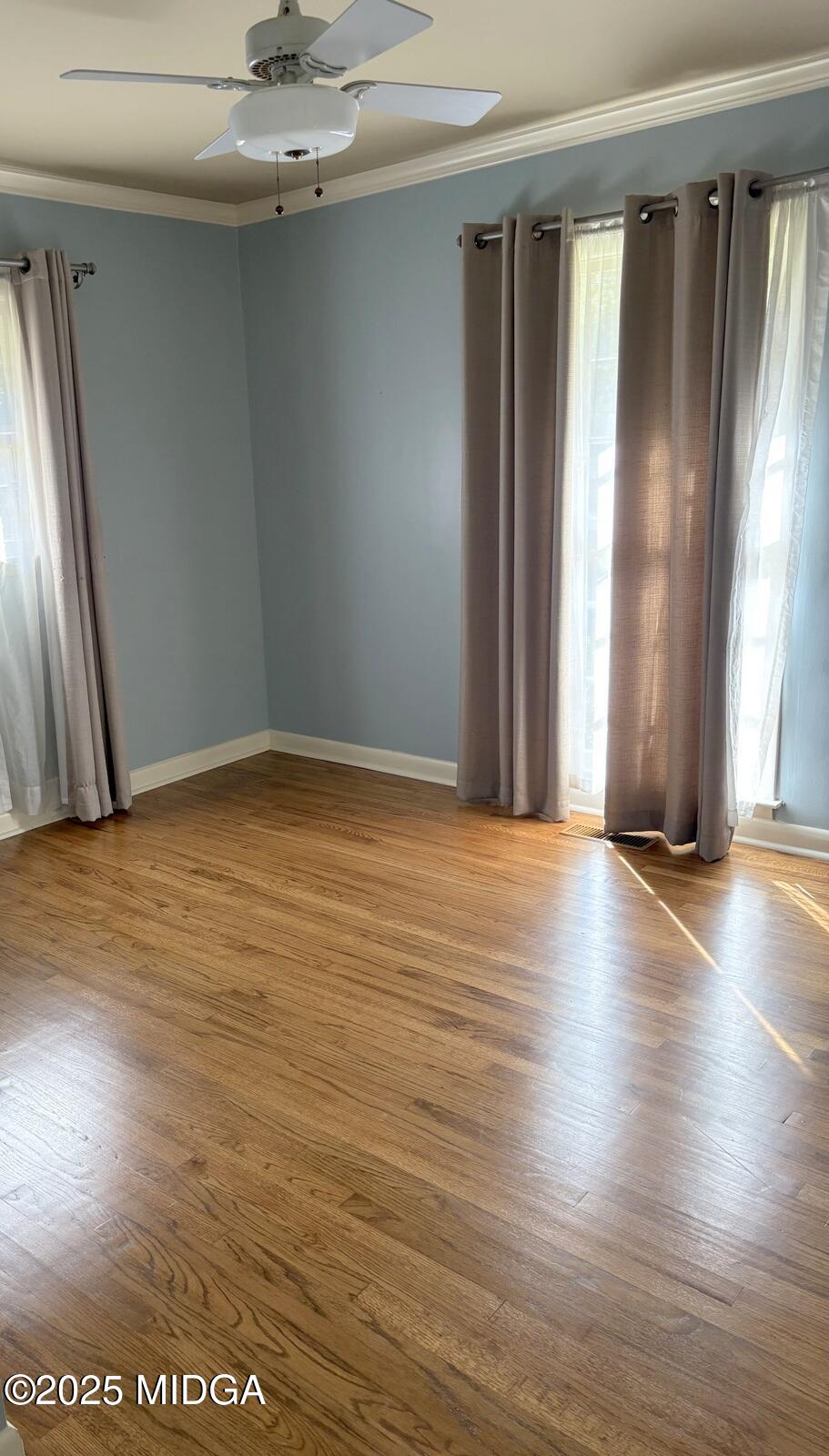 161 Ten Knolls Drive Macon, GA 31210 - Photo 13 of 21 an empty room with wooden floor and windows