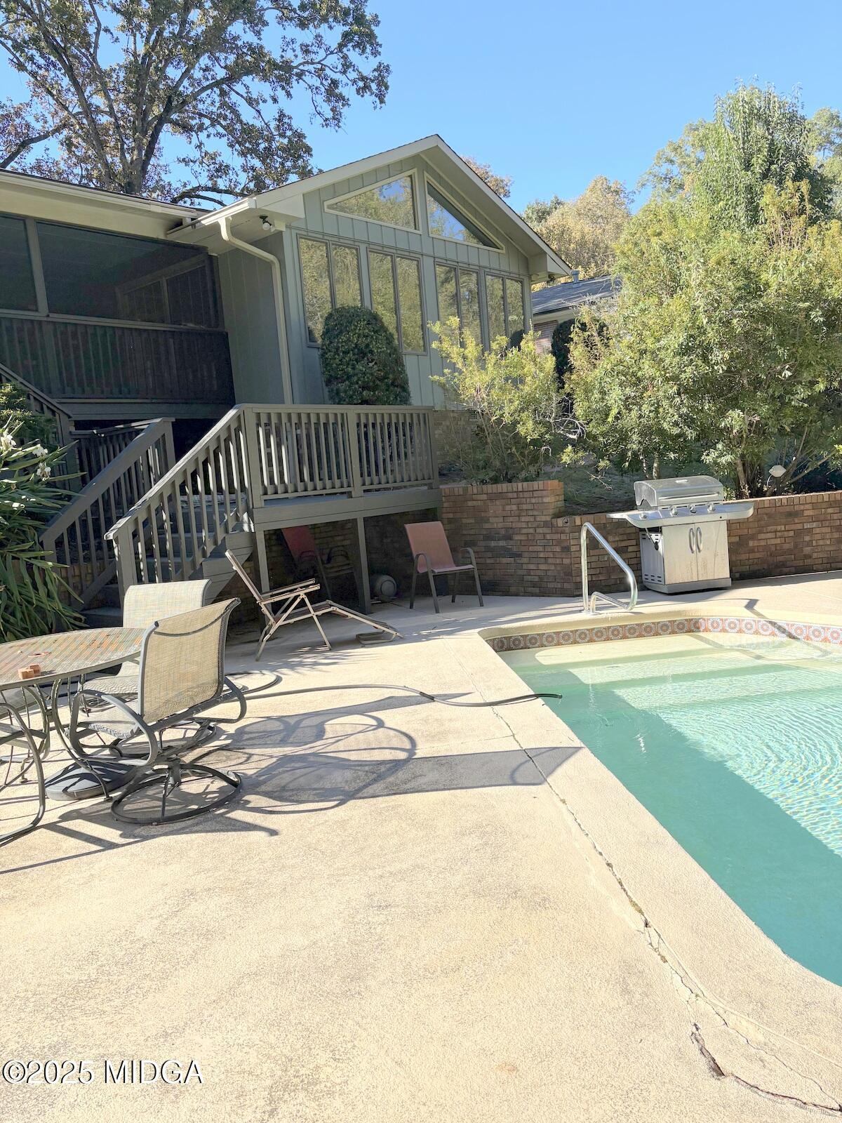 161 Ten Knolls Drive Macon, GA 31210 - Photo 2 of 21 a view of a house with backyard and sitting area