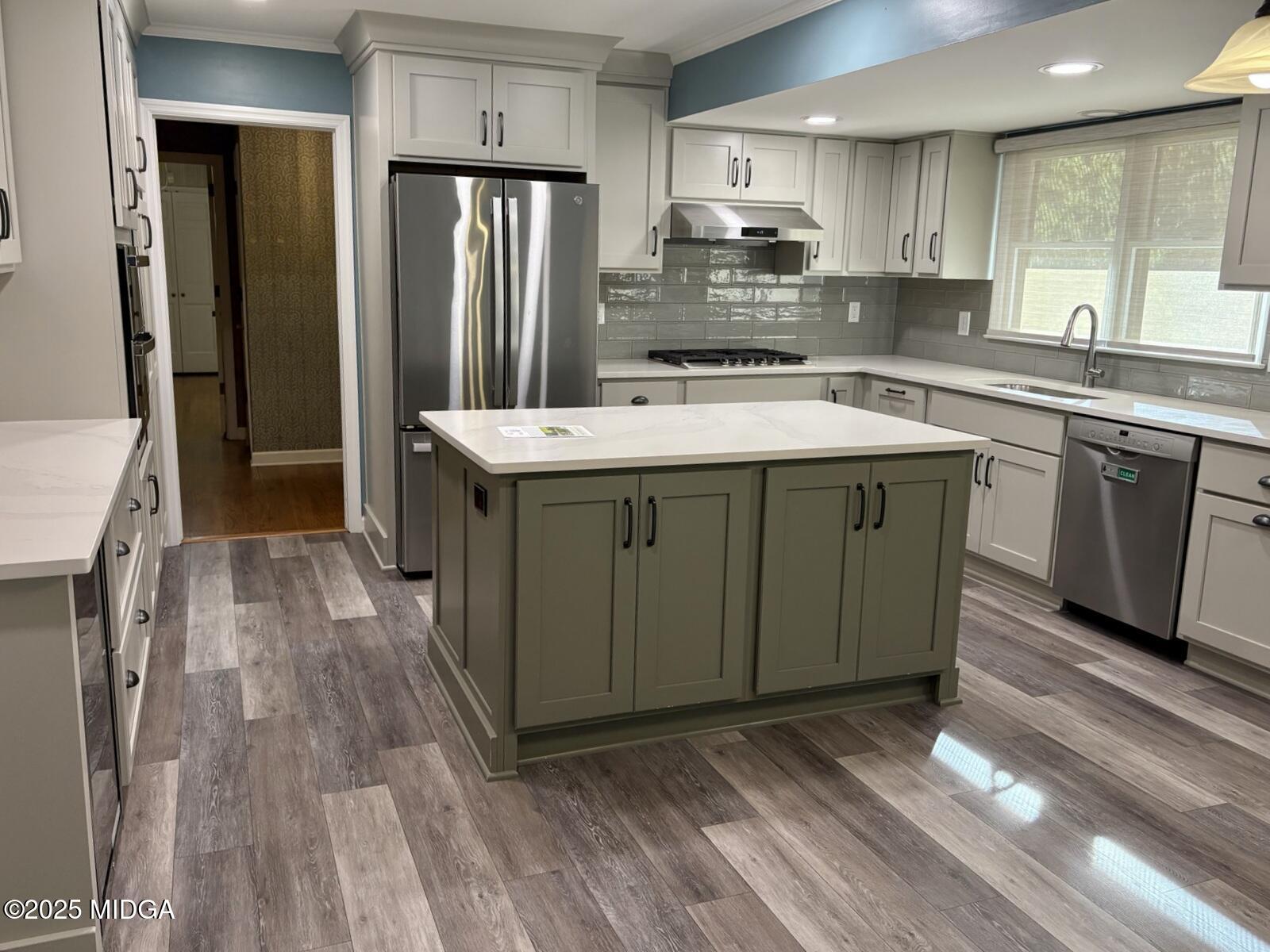 161 Ten Knolls Drive Macon, GA 31210 - Photo 5 of 21 a kitchen with a sink stove and refrigerator
