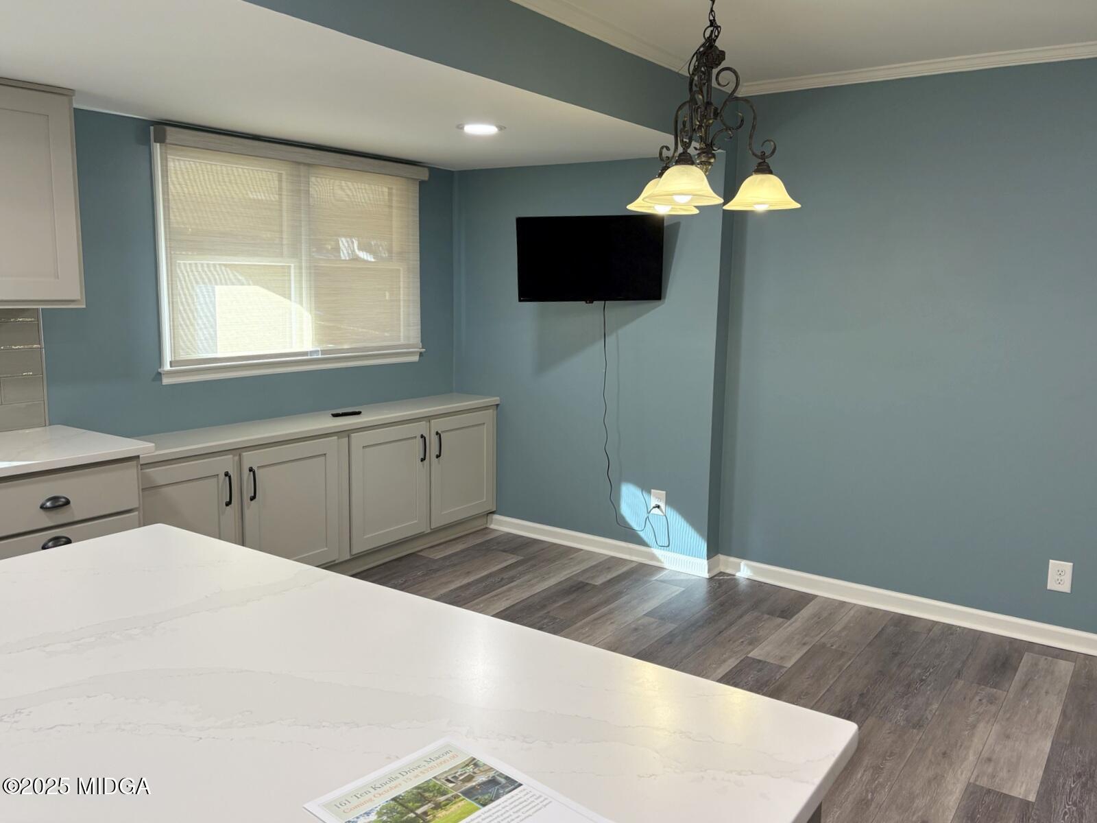 161 Ten Knolls Drive Macon, GA 31210 - Photo 6 of 21 a kitchen with a refrigerator and a flat screen tv