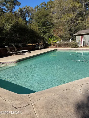a view of a park with large trees