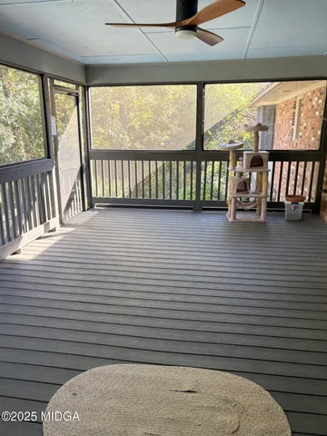 a view of a porch with furniture